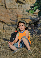 Educated little boy during a hiking expedition