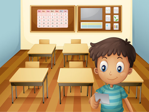 A young boy inside the classroom