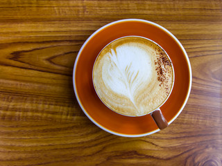 Coffee cup on the wooden table