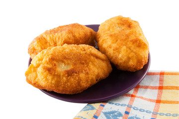 Fresh baked russian pastry pirozhki isolated on white