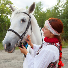 The girl stroking horse