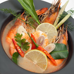 Tom yum goong spicy Thai seafood soup in bowl