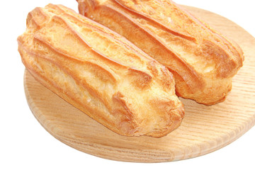 Choux pastry (Eclair) on the chopping Board