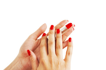 Female Hands Holding Red Lipstick On White Background
