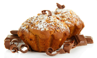 Tasty muffin cakes with powdered sugar and chocolate, isolated