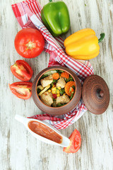 Baked mixed vegetable with chicken breast in pot,