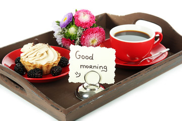 Cup of tea with cakes on wooden tray isolated on white