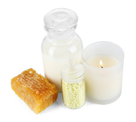 Honey and milk spa with oils and honey isolated on white