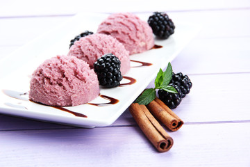 Delicious ice cream on plate on table close-up