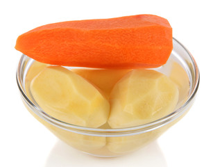 Peeled vegetables in bowl isolated on white