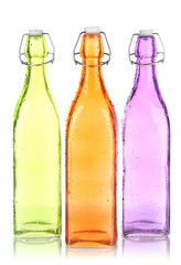 Colorful bottles isolated on white