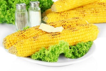 Delicious golden grilled corn with butter close-up