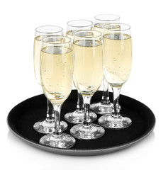 Many glasses of champagne on the tray, isolated on white