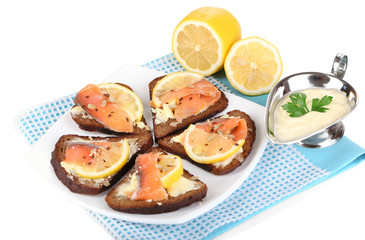 Salmon sandwiches on plate  isolated on white