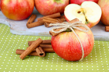 Ripe apples with with cinnamon sticks