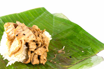 stick rice with pork wrapped in banana leaves