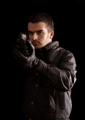 Young man holding a gun