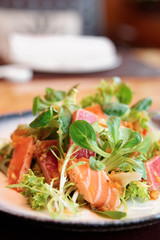 Appetizer with rare fried tuna and salmon