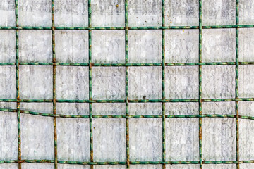 metal grid with metallic surface in background
