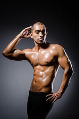 Fototapeta premium Ripped young man in bodybuilding concept