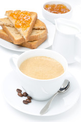 close-up of cappuccino, milk and fresh toast with jam on white