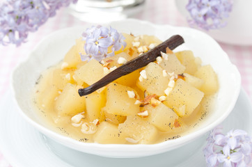 compote of apples and pears with vanilla in a bowl close-up