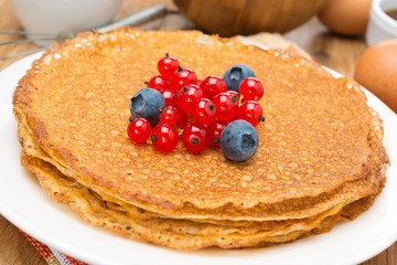 crepes with fresh berries close-up, horizontal
