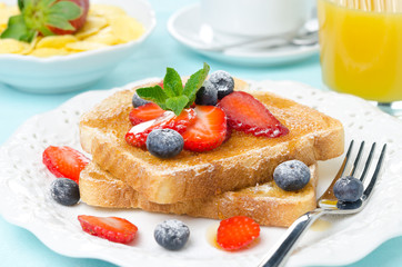 crispy toast with honey, fresh berries, cup of coffee, juice