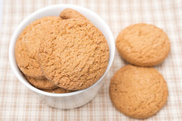 delicious oatmeal cookies in a bowl, selective focus