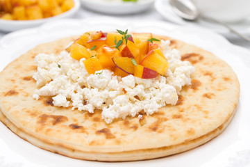 Flat bread with cottage cheese, honey, nuts, peaches and thyme