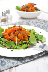 salad with arugula, black lentils, vegetable stew