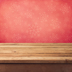 Christmas background with wooden table and snowflakes pattern