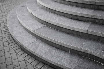 Curved modern gray stone stairs in the city