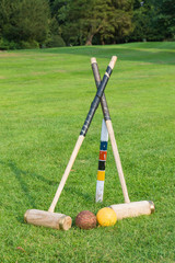 Croquet equipment propped up ready for use