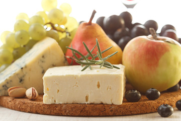 Various types of cheese and fruits composition