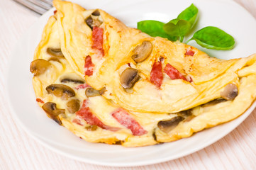 Omelet with mushrooms and salami