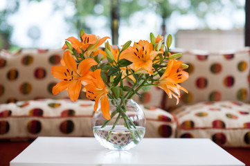 orange lilies in a vase