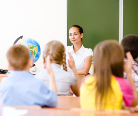 School children in classroom at lesson