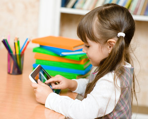 little girl using tablet computer