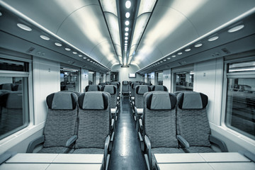 Modern train coach interior view.