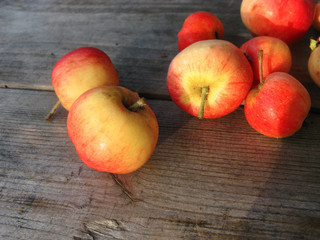 Red apples on a wooden surface