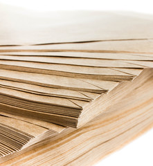 Stack Of Recycled Paper envelopes isolated on white background,