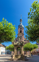 Fototapeta na wymiar Fountain and Church of St. Alexander in Rastatt - Baden-Wurttemb