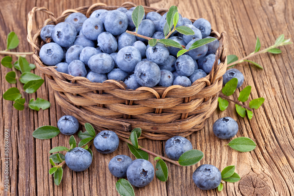 Canvas Prints basket with fresh blueberry on wooden background