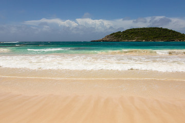 Fototapeta na wymiar Atlantic Waves on Beautiful Golden Sandy Beach Antigua