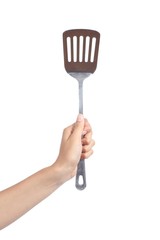 Woman hand holding a spatula