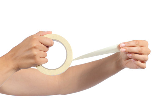 Woman Hands Holding And Using A Masking Tape