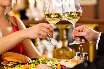 happy couple have a romantic date in restaura