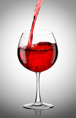 Obraz na płótnie Canvas Red wine pouring