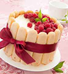 Cake "Charlotte" with raspberries and cream, selective focus.